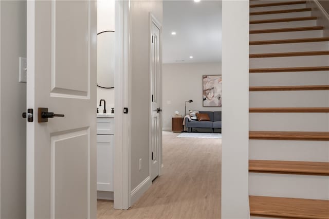 interior space with hardwood / wood-style floors and sink