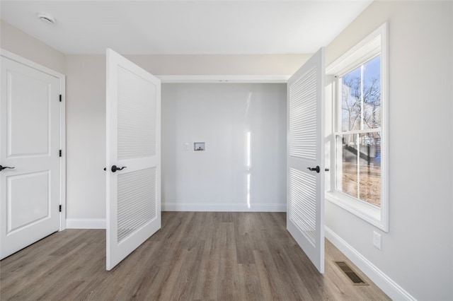 hall with light wood-type flooring