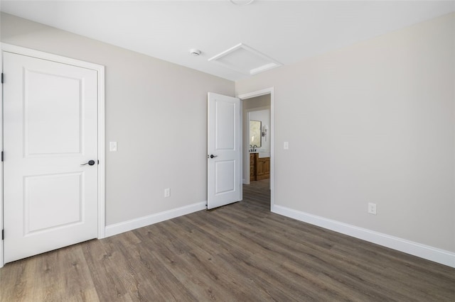 unfurnished room with dark hardwood / wood-style flooring