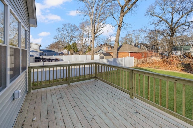 wooden deck with a lawn