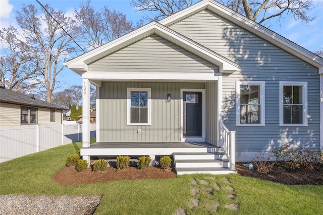 bungalow-style house with a front lawn