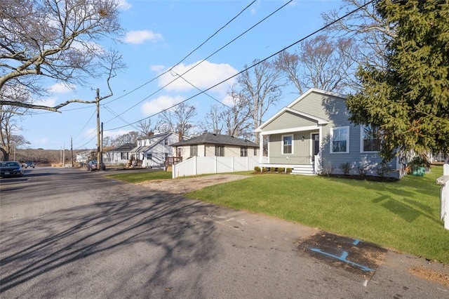 view of front of property with a front yard and a porch