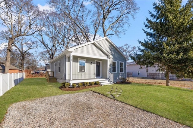 view of front facade with a front lawn and a porch