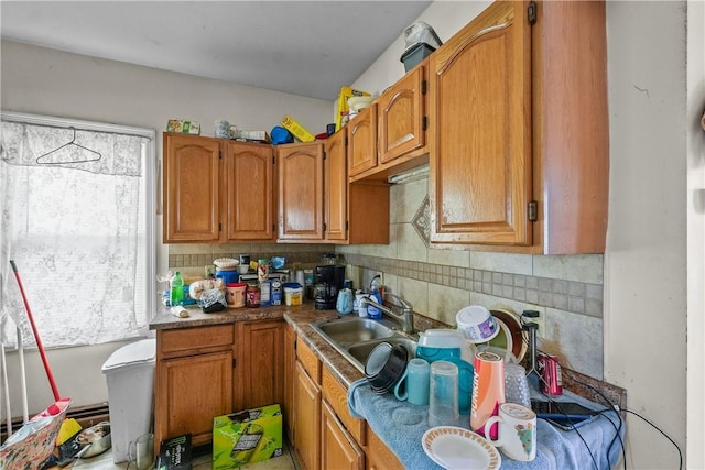 kitchen featuring sink and tasteful backsplash