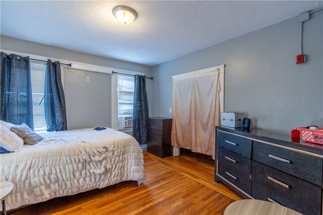 bedroom with hardwood / wood-style flooring