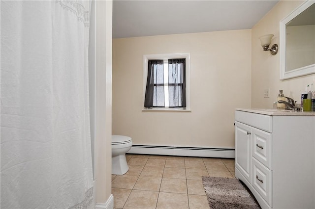 bathroom with tile patterned floors, vanity, toilet, and baseboard heating