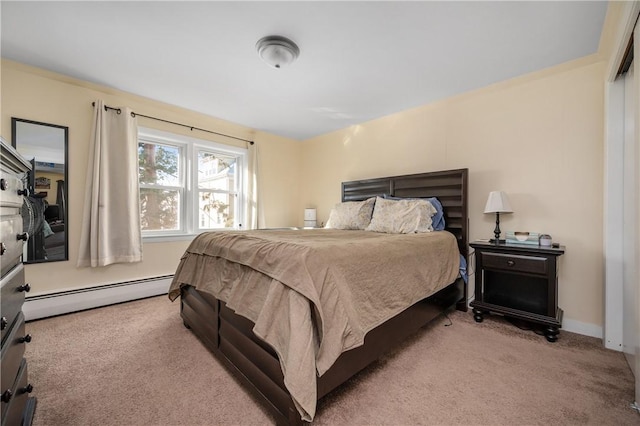 carpeted bedroom featuring baseboard heating