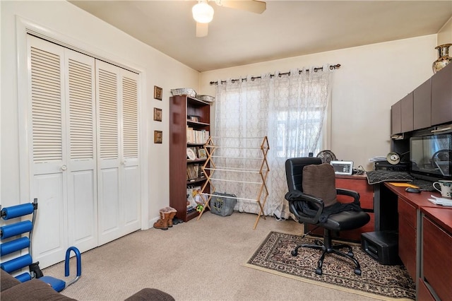 office space with ceiling fan and light colored carpet