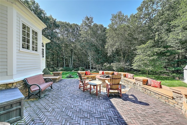 view of patio / terrace with an outdoor fire pit