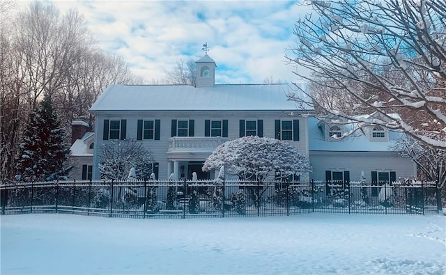 view of snow covered house