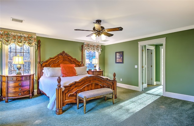 carpeted bedroom with multiple windows, crown molding, and ceiling fan