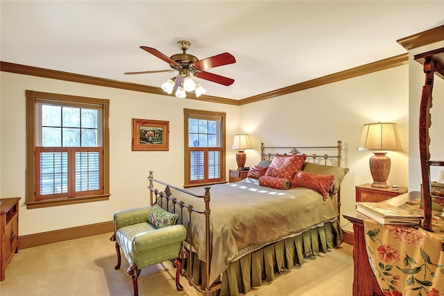 bedroom with multiple windows, ceiling fan, and light colored carpet