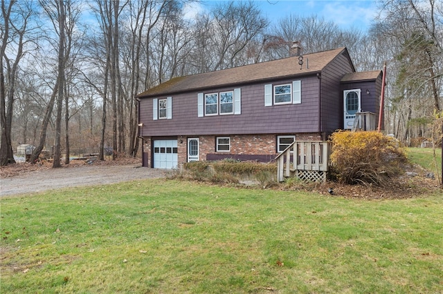 view of front of property with a garage and a front yard