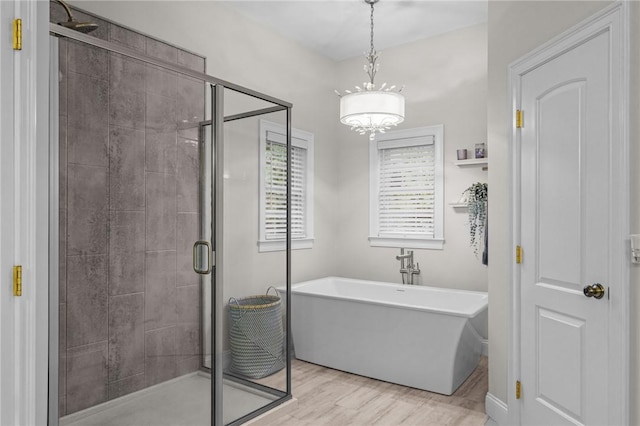 bathroom with wood-type flooring and plus walk in shower