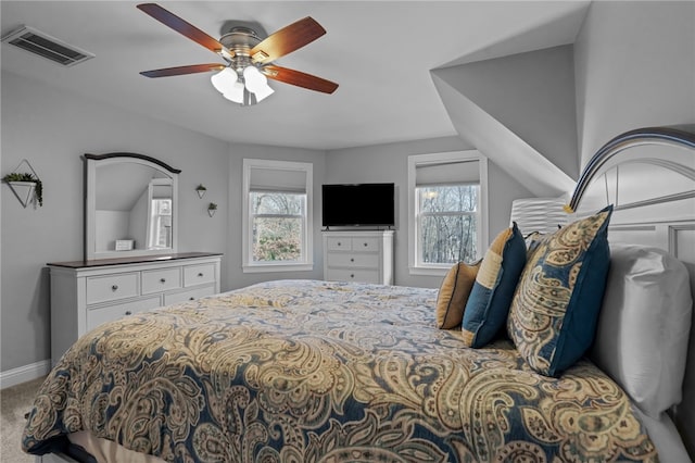 carpeted bedroom with ceiling fan and lofted ceiling