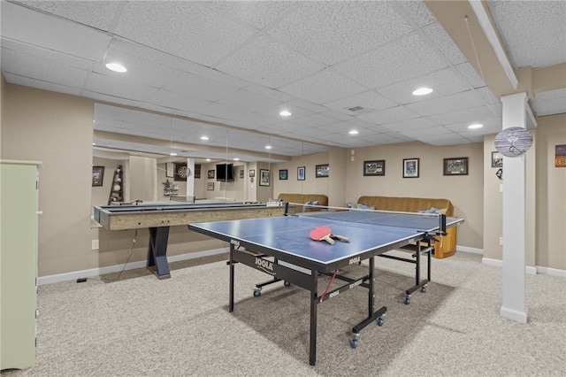 recreation room with carpet flooring and a drop ceiling