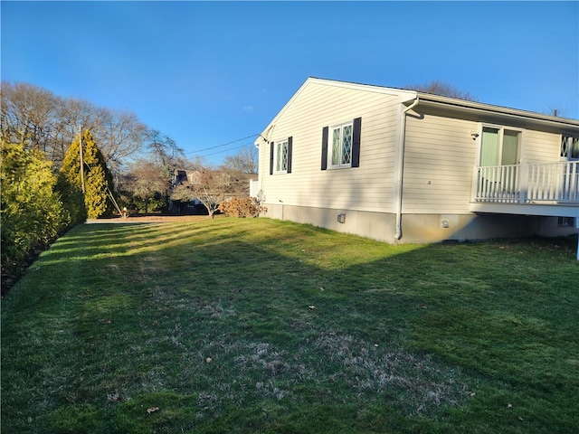 view of home's exterior featuring a yard