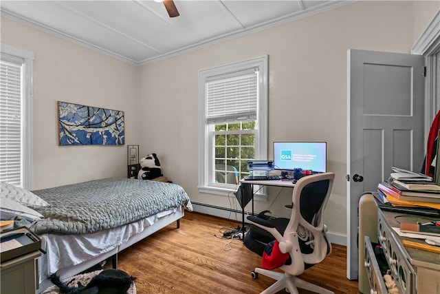 bedroom with wood-type flooring, a baseboard radiator, ceiling fan, and ornamental molding