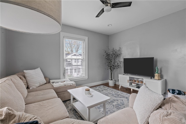 living room with hardwood / wood-style flooring and ceiling fan