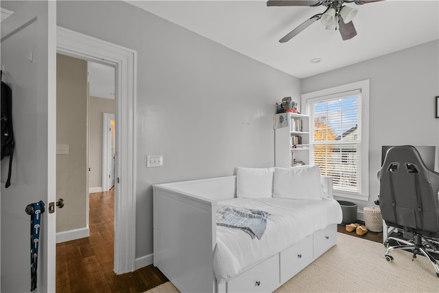 bedroom featuring hardwood / wood-style flooring and ceiling fan