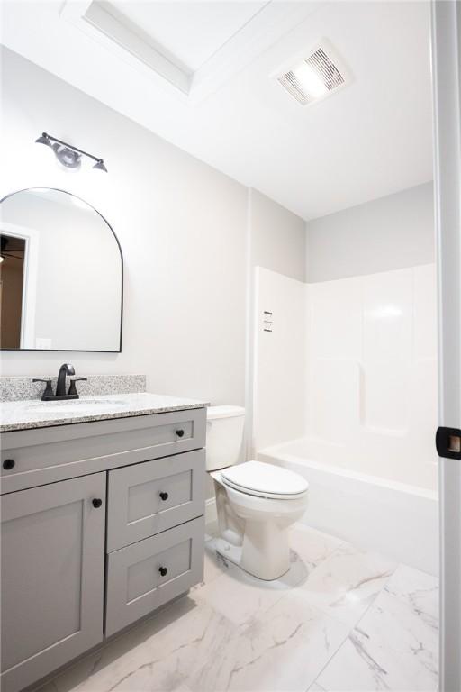 full bathroom with vanity,  shower combination, and toilet