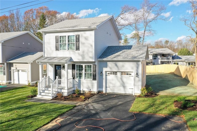 view of front facade with a garage and a front lawn