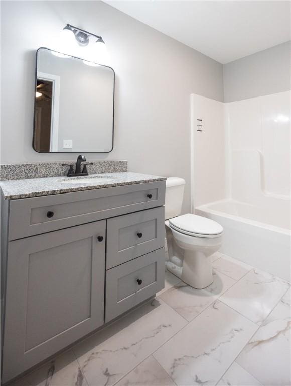 full bathroom featuring vanity, shower / bath combination, and toilet