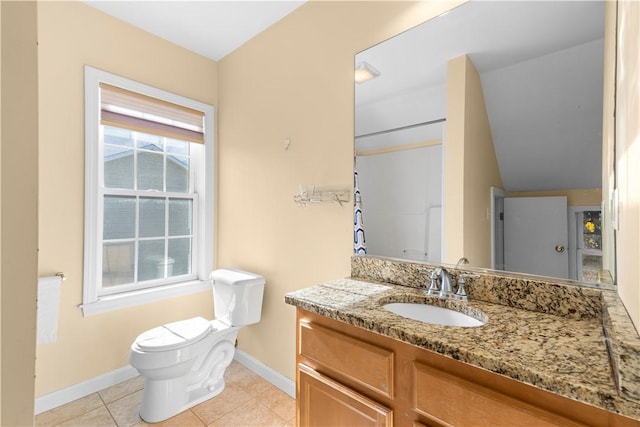 bathroom with tile patterned floors, vanity, and toilet