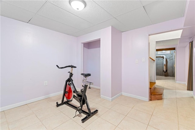 workout room with a paneled ceiling