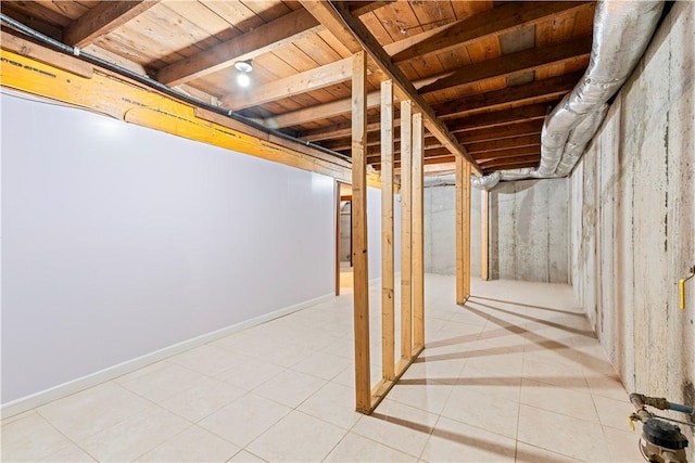 basement featuring wooden ceiling