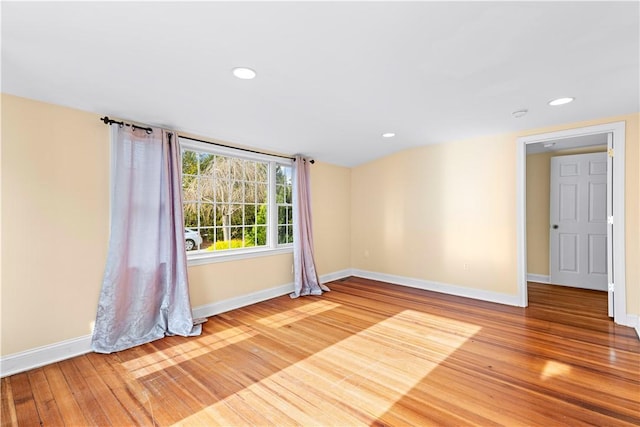 unfurnished room with light hardwood / wood-style floors