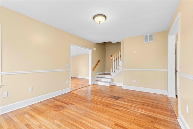 spare room featuring hardwood / wood-style floors