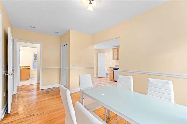 unfurnished dining area featuring light wood-type flooring