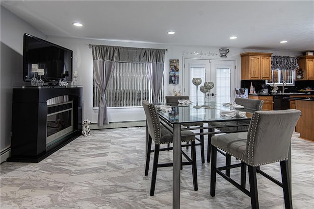 dining area with baseboard heating