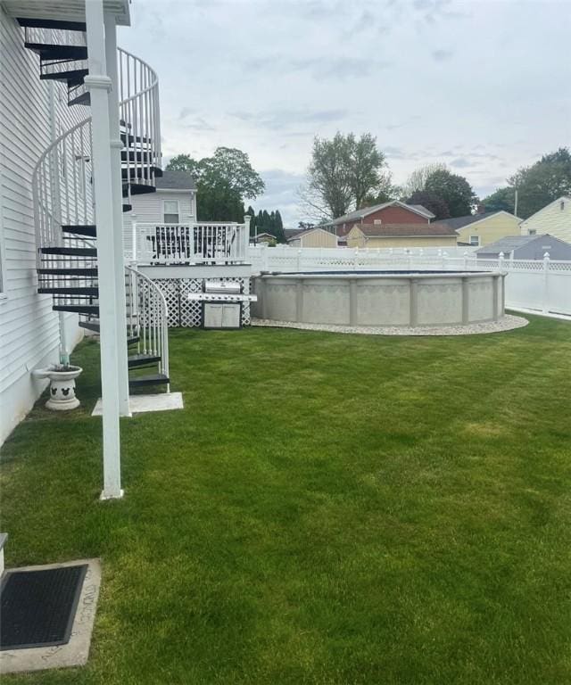 view of yard featuring a pool side deck