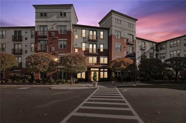 view of outdoor building at dusk