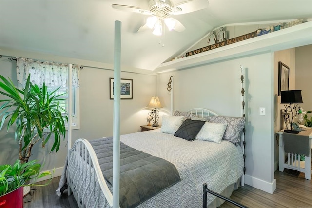 bedroom featuring hardwood / wood-style floors, ceiling fan, and lofted ceiling