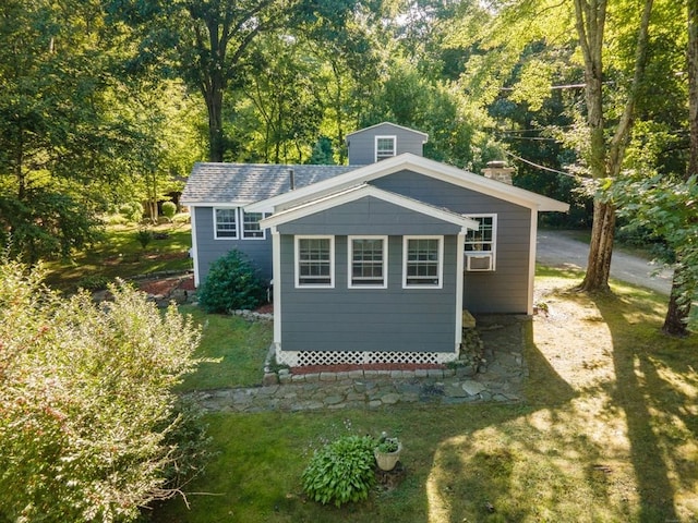 view of outdoor structure featuring a lawn