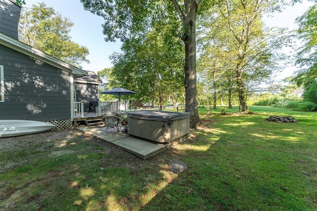 view of yard featuring a patio area and a deck