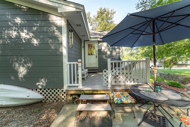 exterior space featuring a wooden deck