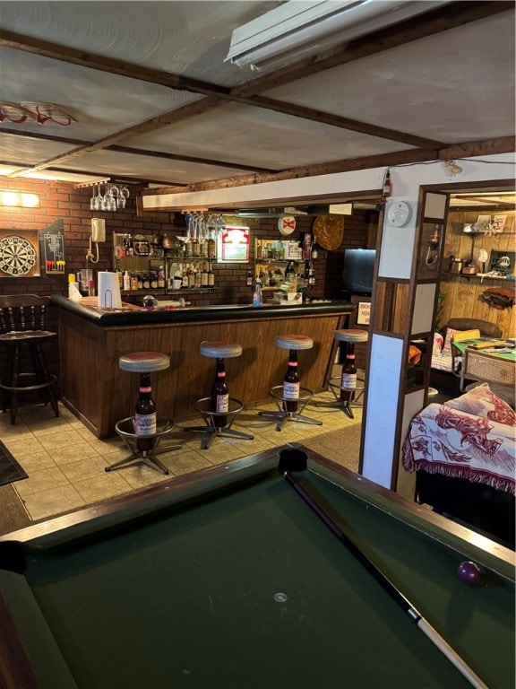 bar with brick wall and pool table