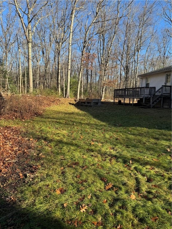 view of yard featuring a wooden deck