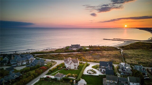 aerial view at dusk with a water view