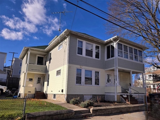 view of front of home with a sunroom