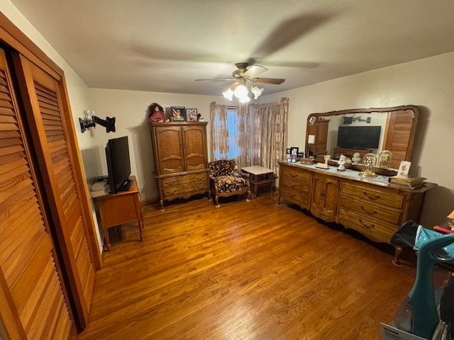 bedroom featuring wood-type flooring and ceiling fan