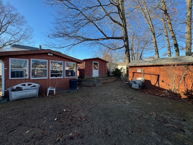 exterior space with a shed