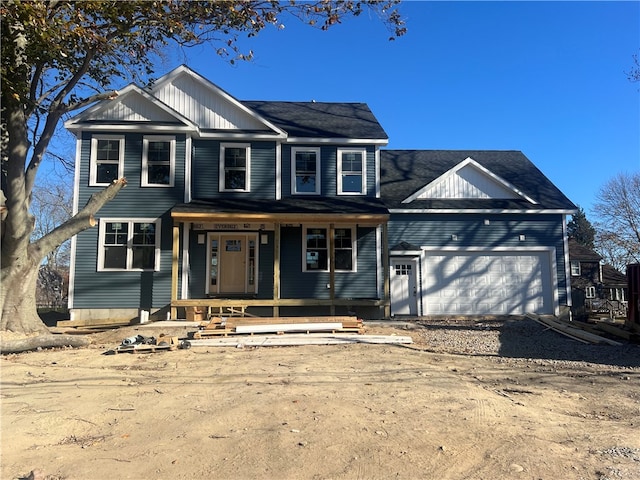 view of front of home with a porch and a garage