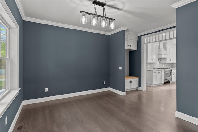 interior space featuring dark hardwood / wood-style floors and crown molding