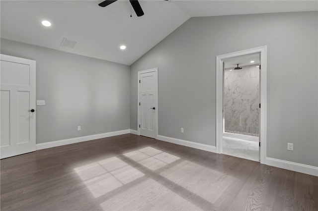 spare room featuring hardwood / wood-style floors, ceiling fan, and vaulted ceiling