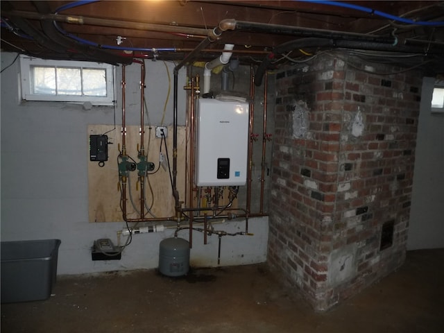 utility room featuring tankless water heater